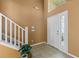 Bright foyer with ceramic tile flooring and a staircase to the upper level at 121 Madiera Beach Blvd, Kissimmee, FL 34746