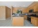 Open kitchen layout with stainless steel appliances and center island, perfect for entertaining at 121 Madiera Beach Blvd, Kissimmee, FL 34746