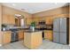 Spacious kitchen with stainless steel appliances, center island, and abundant cabinet space at 121 Madiera Beach Blvd, Kissimmee, FL 34746