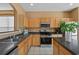 Well-equipped kitchen with stainless steel appliances, ample cabinetry, and efficient layout at 121 Madiera Beach Blvd, Kissimmee, FL 34746