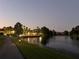 A scenic view of the lake at night with community amenities at 121 Madiera Beach Blvd, Kissimmee, FL 34746