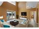 Bright living room with soaring ceilings and direct access to the outdoor patio with water view at 121 Madiera Beach Blvd, Kissimmee, FL 34746