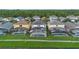 Rear view of several homes featuring private pools with screen enclosures at 121 Madiera Beach Blvd, Kissimmee, FL 34746