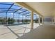 A screened-in pool and patio with a view of the lake at 121 Madiera Beach Blvd, Kissimmee, FL 34746