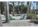 Well-maintained community putting green surrounded by palm trees and landscaping at 121 Madiera Beach Blvd, Kissimmee, FL 34746