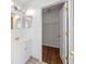 Bathroom vanity with a mirror and a view into the walk-in closet at 1548 Tiverton Blvd, Winter Garden, FL 34787