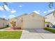 Lovely one-story home featuring a two-car garage, landscaped yard, and neutral color palette at 1548 Tiverton Blvd, Winter Garden, FL 34787