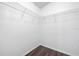 Empty walk-in closet with white wire shelving and wood-look floors at 1548 Tiverton Blvd, Winter Garden, FL 34787