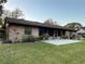 Brick home with a back patio, perfect for outdoor relaxing at 2867 Longleaf Ct, Kissimmee, FL 34746