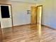 Large bedroom with wood flooring and door to exterior at 2867 Longleaf Ct, Kissimmee, FL 34746