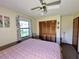 Main bedroom with king-size bed and built-in closet at 2867 Longleaf Ct, Kissimmee, FL 34746
