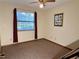 Bedroom with carpeted floors and a large window at 2867 Longleaf Ct, Kissimmee, FL 34746