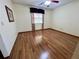 Spacious bedroom with laminate wood flooring and window coverings at 2867 Longleaf Ct, Kissimmee, FL 34746
