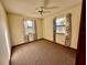 Bright bedroom with carpeted floors and two windows at 2867 Longleaf Ct, Kissimmee, FL 34746