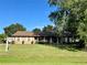 Brick ranch house with a manicured lawn at 2867 Longleaf Ct, Kissimmee, FL 34746