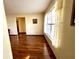 Spacious living room featuring hardwood floors and a view to another room at 2867 Longleaf Ct, Kissimmee, FL 34746