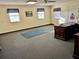 Spacious office features large windows, wood desk, and carpet flooring at 2867 Longleaf Ct, Kissimmee, FL 34746
