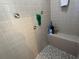 Clean shower with tiled walls and built-in seat at 2867 Longleaf Ct, Kissimmee, FL 34746