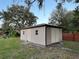 Tan storage shed with a side door at 2867 Longleaf Ct, Kissimmee, FL 34746