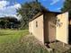 Tan storage shed in a grassy yard at 2867 Longleaf Ct, Kissimmee, FL 34746