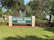 Entrance sign for Southern Dunes Estates in front of a grassy lawn at 1652 Dunes Ct, Haines City, FL 33844