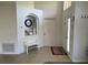 Inviting foyer featuring a niche, tile flooring, and front door at 1652 Dunes Ct, Haines City, FL 33844