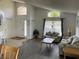 Cozy living room with large windows, comfortable seating, and an open floor plan at 1652 Dunes Ct, Haines City, FL 33844