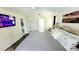 Serene main bedroom with a TV, en-suite bathroom, and calming decor at 1652 Dunes Ct, Haines City, FL 33844