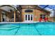 Beautiful screened-in pool and lanai with easy access to the home's interior at 1652 Dunes Ct, Haines City, FL 33844