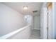 Bright hallway with hardwood floors and white paint provides a clean transition to the bedrooms at 2945 Cello Ln, Kissimmee, FL 34741