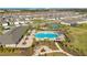 Aerial shot of the community pool, clubhouse, and landscaped areas, showcasing the community's amenities at 1853 Summer Serenity Dr, Kissimmee, FL 34744