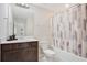 A well-maintained bathroom features a vanity with a framed mirror and a tub with a shower at 1853 Summer Serenity Dr, Kissimmee, FL 34744