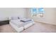 A bedroom with a bed next to windows letting in natural light at 1853 Summer Serenity Dr, Kissimmee, FL 34744