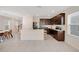 Spacious kitchen with stainless steel appliances, island, and open layout to dining and living areas at 1853 Summer Serenity Dr, Kissimmee, FL 34744