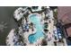 Aerial view showcases a luxurious pool, palm trees, and plenty of lounge chairs, all designed for relaxation at 2716 Bushman Dr, Kissimmee, FL 34746
