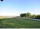 Beautiful lawn area featuring a large pond, sidewalk and some shade trees at 14315 Swanley St, Orlando, FL 32832