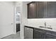 The bar features granite counters, stainless steel undercounter refrigerator at 267 Spinnaker Ct, Auburndale, FL 33823