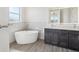 This bathroom features a large, white tub and double sink vanity at 267 Spinnaker Ct, Auburndale, FL 33823