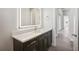 This bathroom features a single sink vanity with granite counters at 267 Spinnaker Ct, Auburndale, FL 33823
