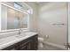 This bathroom features a single sink vanity with granite counters and walk in shower at 267 Spinnaker Ct, Auburndale, FL 33823
