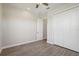 This bedroom has wood-look tile flooring and a ceiling fan at 267 Spinnaker Ct, Auburndale, FL 33823