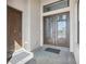 Grand double door entry with tiled porch and transom window at 267 Spinnaker Ct, Auburndale, FL 33823