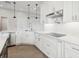 Gourmet kitchen with stainless steel appliances, custom cabinets, and quartz countertops at 267 Spinnaker Ct, Auburndale, FL 33823