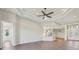 Bright, open living area with tray ceilings, recessed lighting, and access to kitchen at 267 Spinnaker Ct, Auburndale, FL 33823