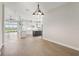 Great view of the living, dining, and kitchen area with tile flooring and neutral color palette at 267 Spinnaker Ct, Auburndale, FL 33823