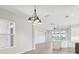 Large open concept living area with dining area and kitchen featuring stainless steel appliances at 267 Spinnaker Ct, Auburndale, FL 33823