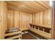 Inviting wooden sauna room with benches for relaxation and wellness at 267 Spinnaker Ct, Auburndale, FL 33823