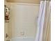 Bathroom featuring a shower and bathtub combination with tiled walls and a shower caddy at 319 Celebration Blvd, Celebration, FL 34747
