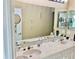 Bathroom featuring dual sinks and a large mirror at 319 Celebration Blvd, Celebration, FL 34747