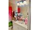 Bathroom featuring a single sink vanity with a watermelon themed shower curtain and decorative rug at 319 Celebration Blvd, Celebration, FL 34747